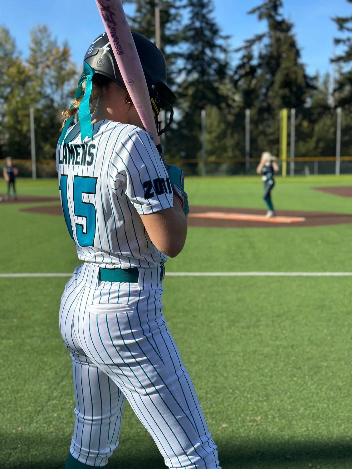 United Softball batter preparing for a pitch.